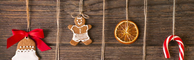 Christmas gingerbread cookies on wood background